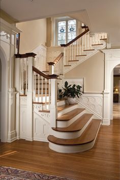 a staircase in a house with wood floors