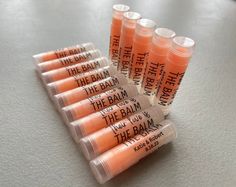 "Handmade Orange MIMOSA Sweetened Flavored Personalized Lip Balms in Clear Tubes with Clear Labels! Fast Shipping  The wording can say anything you like. - Handmade Mimosa Flavored Lip Balms - Personalize with Your Wording on them with Clear Labels Adhered Already - Peanut, Gluten, Dairy, Tree Nut and Paraben Free - Lip Balm is Tinted Orange Color and Comes in Round .15oz Clear Tubes with Clear Caps. Will Apply Clear on the Lips. - Tubes are MADE IN THE USA and are BPA Free ❤ Made Fresh When Your Order is Placed and Will Ship Within 1-3 Business Days. ❤ ➽ In a RUSH? You can use this listing to Jump the Line and get your order out the door faster than our regular processing time. Simply add this listing to your cart when ordering. https://www.etsy.com/listing/1295585879/rush-my-order-jump-t Lip Balm Party Favors, Orange Mimosa, Stop Bragging, Personalized Lip Balm, Clear Labels, Flavored Lip Balm, Soybean Oil, Chapped Lips, Lip Balms