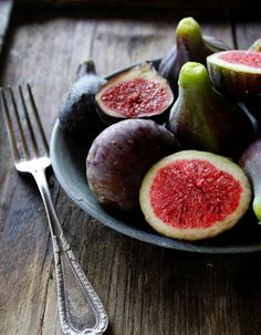 figs on a plate with a fork and knife