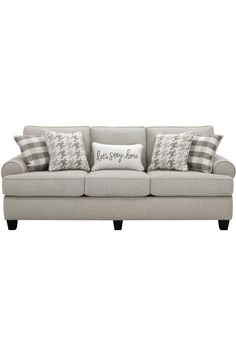 a gray couch with pillows on it