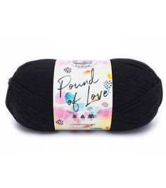 a ball of black yarn with the words pound of love on it