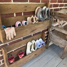 several pairs of shoes are lined up on a wooden shelf next to an old bench