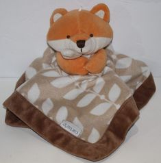 a stuffed animal is wrapped in a blanket