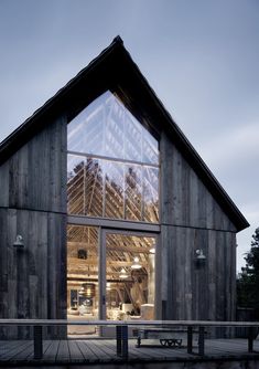 a large wooden building with lots of windows