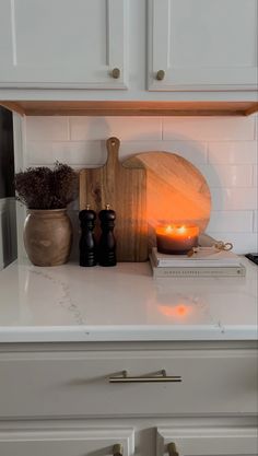 a kitchen counter with some candles on it