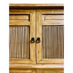 an old wooden cabinet with black knobs