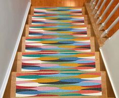 an area rug on the stairs in a house