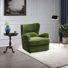 a living room with a green chair and table