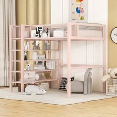 a pink bunk bed sitting in the middle of a room next to a teddy bear