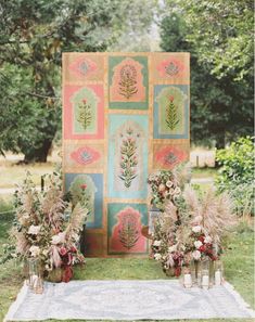 an outdoor ceremony setup with flowers and greenery