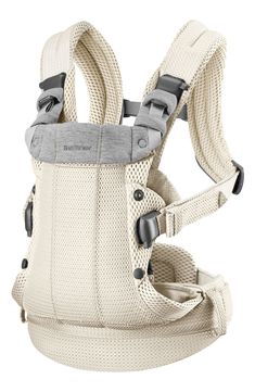 the baby carrier is white and has grey straps