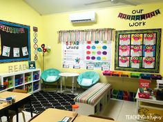 a classroom with desks, chairs and posters on the wall