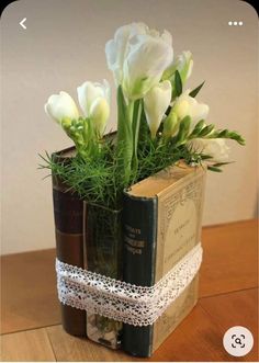 a book with flowers in it sitting on a table