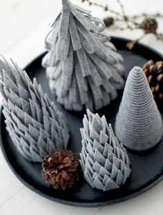 small christmas trees on a plate with pine cones