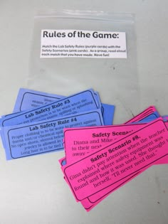 four labels on a table that say rules of the game and safety scenes for children