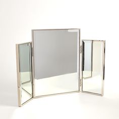 Our Tri-Fold Vanity Mirror features three, double-sided mirror panels with a classic brass trim. See yourself from every angle with this classic mirror. Dimensions Overall 37"W x 23.25"H x 1"D (39.3 lbs) Vanity mirror L front reflective 8"W x 19"H Vanity mirror center overall 18.25"W x 24"H x 1"D Vanity mirror center front reflective 17.25"W x 23"H Vanity mirror center back reflective 18"W x 24"H Vanity mirror R overall 9"W x 20"H x 1"D Vanity mirror R back reflective 8.75"W x 19.75"H  Item is m Tri Fold Vanity Mirror, Vanity Bedroom, Double Sided Mirror, Classic Mirror, Mirror Panels, Brass Trim, How To Clean Mirrors, Bedroom Vanity, Global Views