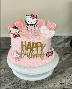 a hello kitty birthday cake with pink frosting