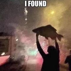 a woman holding an umbrella over her head with fireworks in the background and text that reads, i found