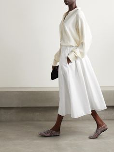 The Row's 'Fleur' skirt is as classic as it gets. Made from crisp cotton-poplin, it has a flattering A-line shape with a knotted tie detailing the left hip and sharp pleats along the back, ensuring it moves softly with your every step. Style it with a half-tucked sweater and ballet flats. Sports Trousers, Shearling Jacket, Dress Trousers, Beach Dresses, White Skirts, Floral Maxi Dress, Jeans Dress, Cotton Poplin, Net A Porter