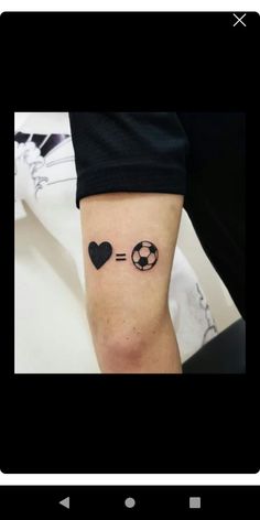 a person with a tattoo on their leg that says love and is in the shape of a