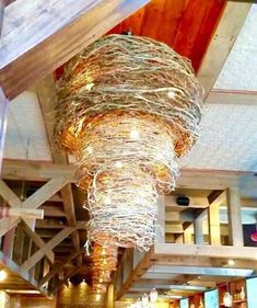 the ceiling is decorated with lights and straw