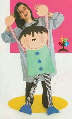 a woman standing next to a child on top of a yellow and pink floor with her arms in the air