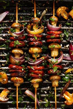 several skewers filled with different types of food