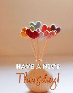 there is a vase with hearts on it and the words have a nice thursday