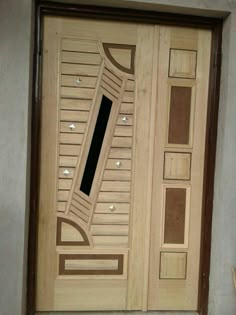 the door is made out of wood and has a decorative design on it's side