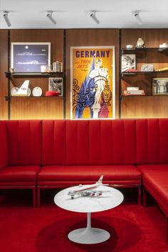 a red couch and table in a room