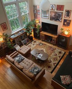 an overhead view of a living room with couches, coffee table, and television