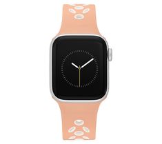 an apple watch with a pink band and white dots on the face, showing the time