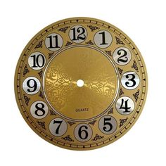 a golden clock with numbers and numerals on it