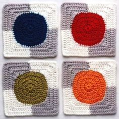 four square crocheted coasters with different colored circles on them, all made up of yarn