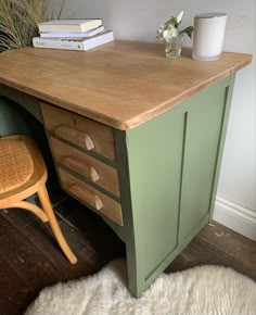 a wooden desk with drawers and a chair next to it