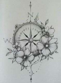 a compass with flowers on it and arrows in the middle is drawn by someone else