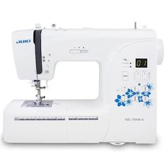 the sewing machine is white with blue flowers on it's front and bottom panel