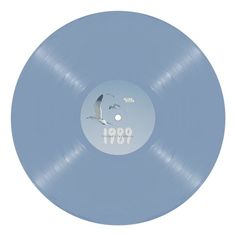 a blue record with an image of a seagull flying in the sky on it