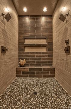 there is a bathroom with tile flooring and stone shower walls in the middle of it