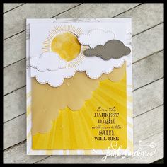 a card with clouds and sun on it