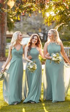 the bridesmaids are all dressed in mint green dresses and smiling for the camera