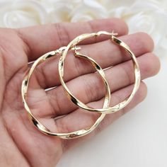 Stunning real 14k yellow gold polished 3mm thick twisted hoop earrings. Perfect for everyday and special occasions. Shiny, elegant and versatile. Perfect gift for her. A must have in your earrings collection. Materials: 14k Yellow Gold Diameter: 46mm Thickness: 3mm Weight: approximately  3.9 grams 14k stamped Brand new  Fast shipping  Check out or 42mm 14k Gold 3mm Twisted Hoop Earrings: https://www.etsy.com/BrizaCollections/listing/1440449027/real-14k-gold-3mm-twisted-hoop-earrings?utm_source=C Cheap Gold Hoop Jewelry, Cheap Gold Hoop Earrings For Party, Cheap Elegant Hoop Earrings, Cheap Elegant Hoop Earrings With Polished Finish, Cheap Gold Plated Earrings For Gift, Cheap Gold Alloy Earrings, Cheap Modern Gold Plated Hoop Earrings, Cheap Elegant Polished Hoop Earrings, Affordable Gold Hoop Earrings For Party