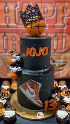 a basketball themed birthday cake with cupcakes