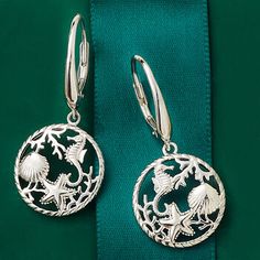 Ross-Simons - Sterling Silver Sea Life Drop Earrings. Capture the beauty of the sea with our sterling silver drop earrings, featuring a myriad of seaside creatures in an open circle design. Textured and polished finishes. Hanging length is 1 1/2". Leverback, sterling silver sea life drop earrings. Silver Ocean-inspired Earrings, Ocean-inspired Silver Jewelry With Matching Earrings, Ocean-inspired Sterling Silver Jewelry With Ear Wire, Sand Dollar Earrings, Shark Pendant, Silver Sea, Gold Sand, Sterling Silver Drop Earrings, Timeless Jewelry