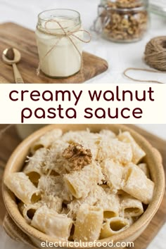 creamy walnut pasta sauce in a wooden bowl next to a jar of yogurt