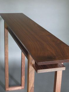 a close up of a wooden table with one end cut out to show the wood grain