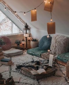 a living room filled with lots of furniture and books on top of a white rug