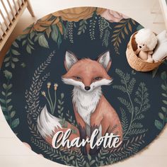 a round rug with an image of a fox on it and the word charlotte written in cursive writing