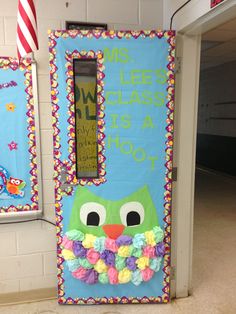 an owl themed door in the shape of a refrigerator with flowers on its front and sides