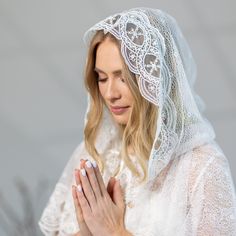 Enhance your spiritual experience with the exquisite beauty of a white floral embroidered veil for church. The Chapel Mantilla Veil is a perfect accessory for those seeking to add an elegant touch to their attire during Mass. Crafted with delicate embroidered lace, this Catholic veil exudes grace and reverence. The intricate floral design on the veil adds a touch of femininity, while the pure white color symbolizes purity and devotion. Its soft and lightweight fabric ensures comfort throughout y White Lace Trim Veil For Ceremony, Traditional White Veil, White Delicate Lace Veil For Ceremony, Church Dress Outfit, Mass Veil, Embroidered Veil, Veil Mantilla, Catholic Veil, Sunday Worship